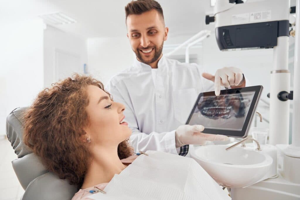 Doctor showing x-ray pictures to patient