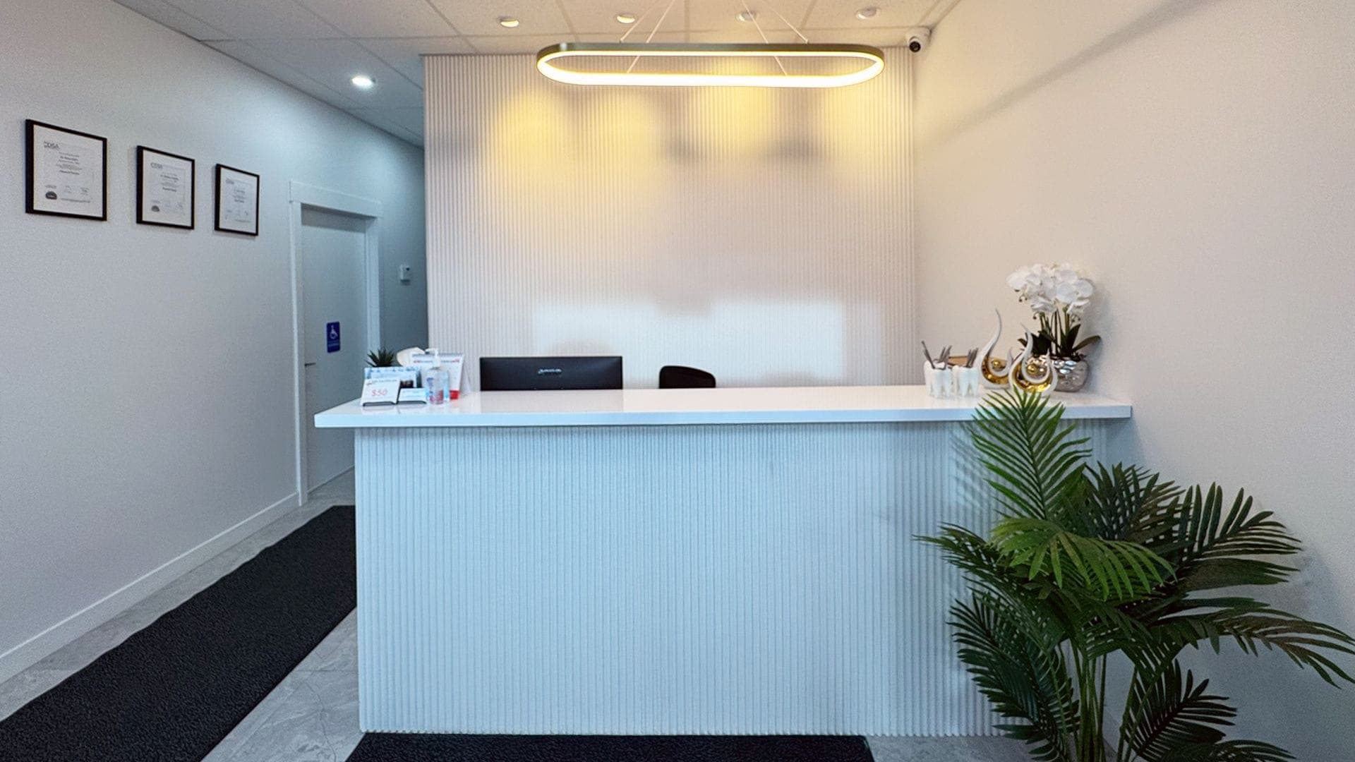 Bright, modern reception area at Smiles At Saddleridge Dental